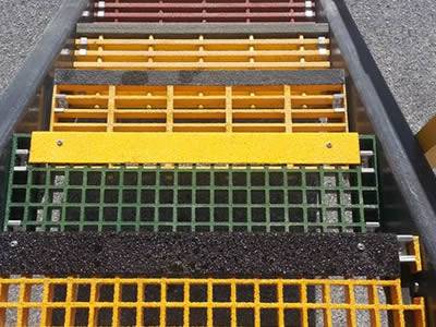 It shows that one stair installed with different styles of gratings, molded and pultruded in yellow, green, red.