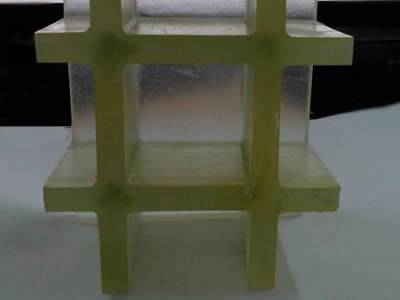 It shows that one piece of translucent green covered FRP grating with translucent cover plate.