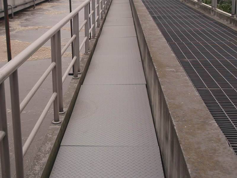 It shows that in a wastewater treatment plant, the FRP covered grating works as walkway.